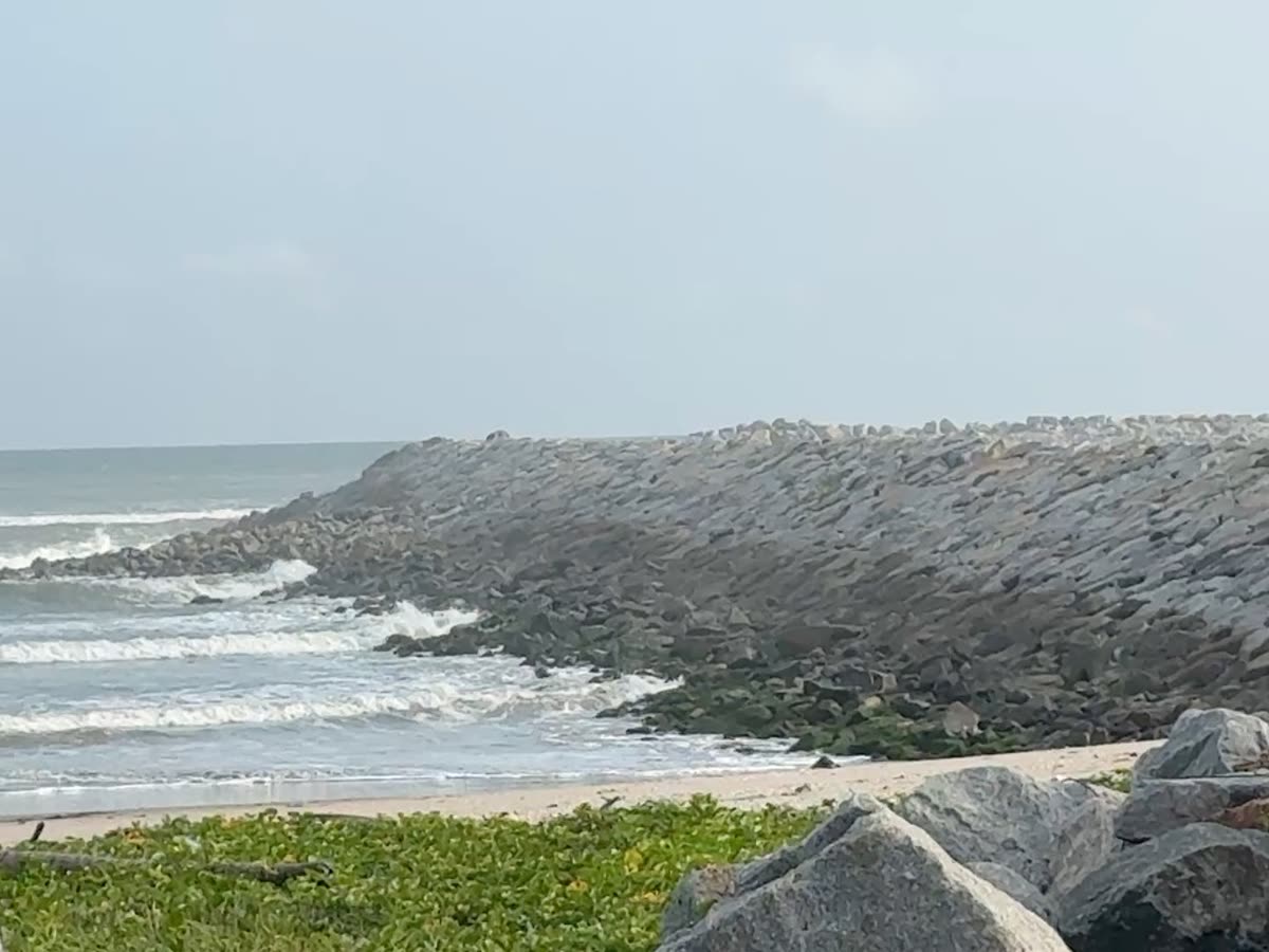 Waves breaking on a rock armour breakwater
